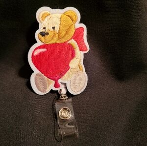 Teddy bear holding a heart shaped balloon retractable badge holder New